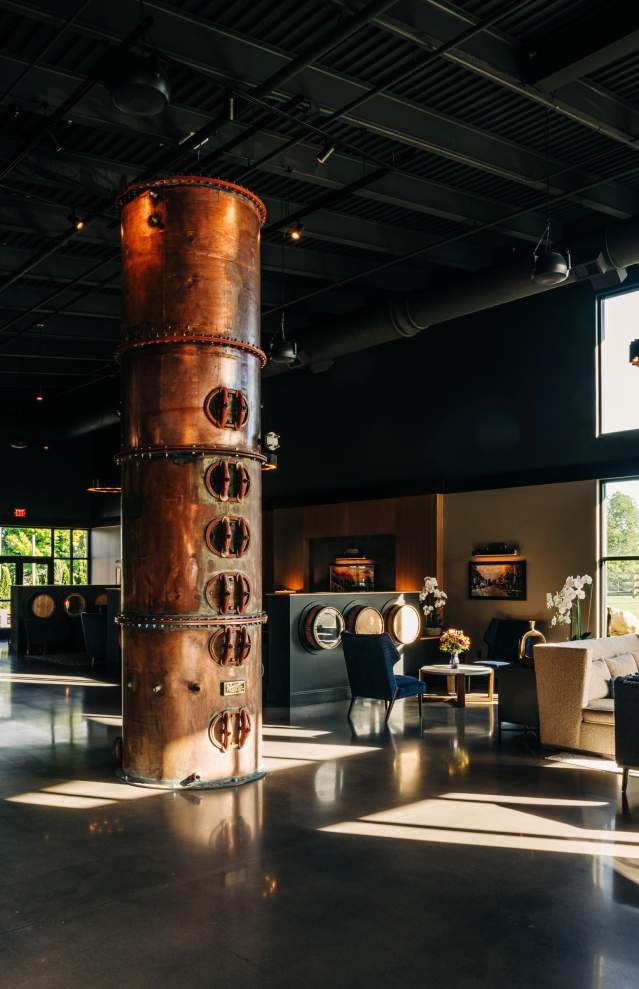 a metal still in hotel lobby, bourbon themed hotel