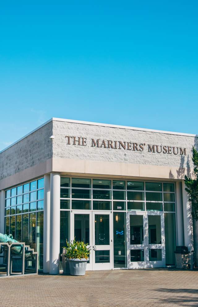 The Mariners' Museum entrance featuring a wind vane with a ship