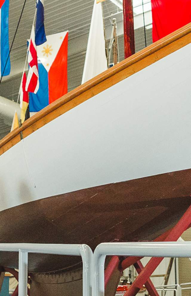 Maritime Museum ship with family standing in front of it