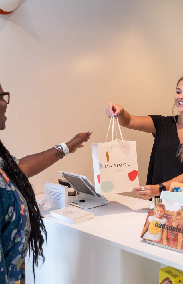 Woman checking out at a boutique