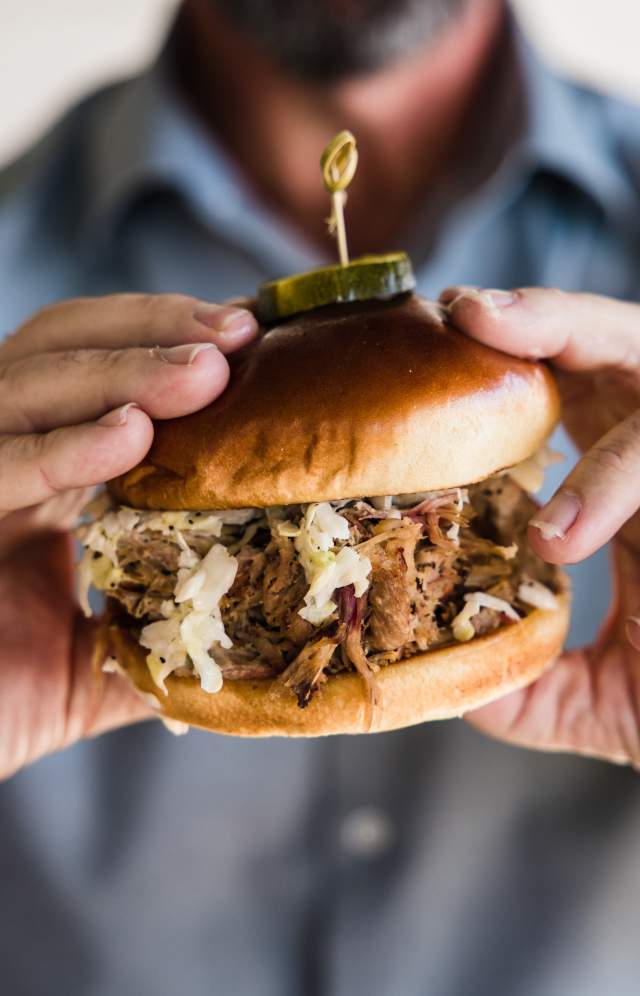 Man holding BBQ Sandwich