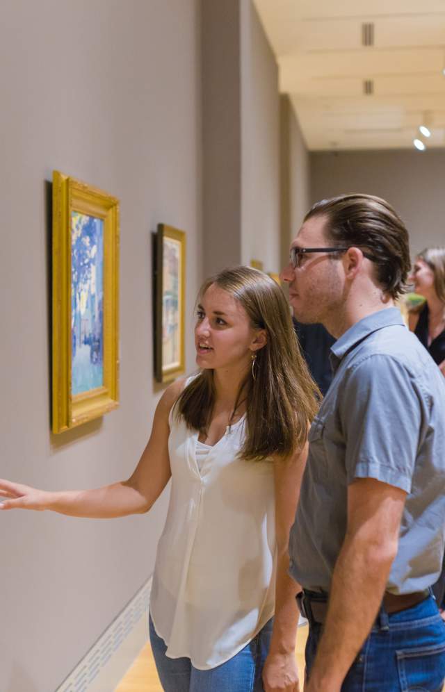 Couple enjoying artwork in a Columbia SC gallery