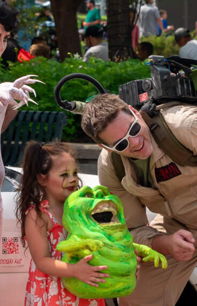 Residents in costume pose during Monster Days in downtown Greeley, Colorado