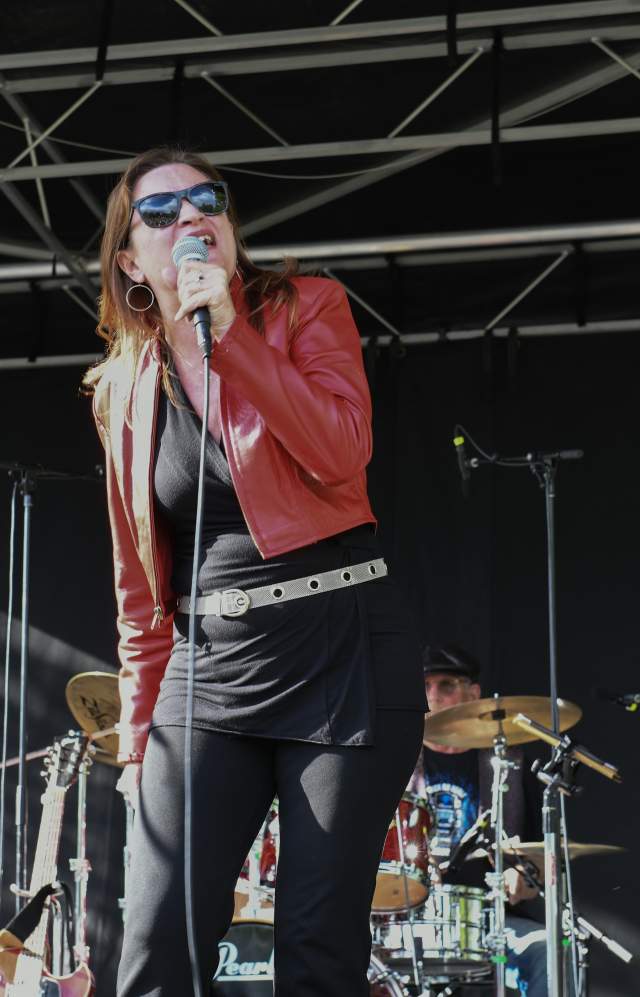 Greeley Blues Jam Singer in Red Jacket and Bassist in Black in Background