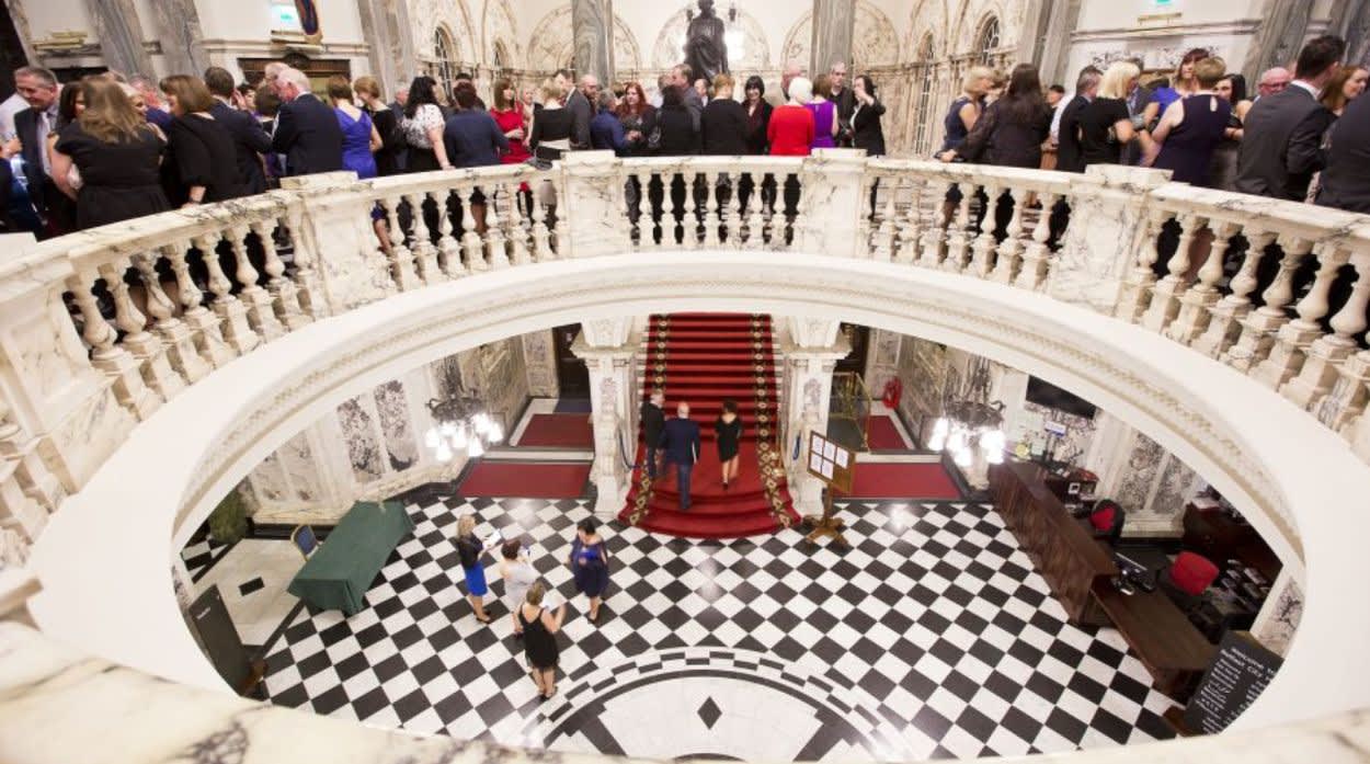 People in city hall rotunda.