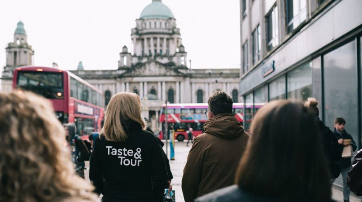 People walking through Belfast on a taste and tour experience.