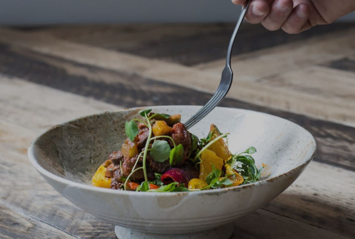 A white plate with healthy food.