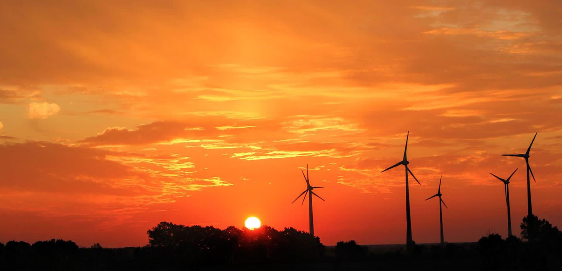 Orange and red sky sunset with wind turbines