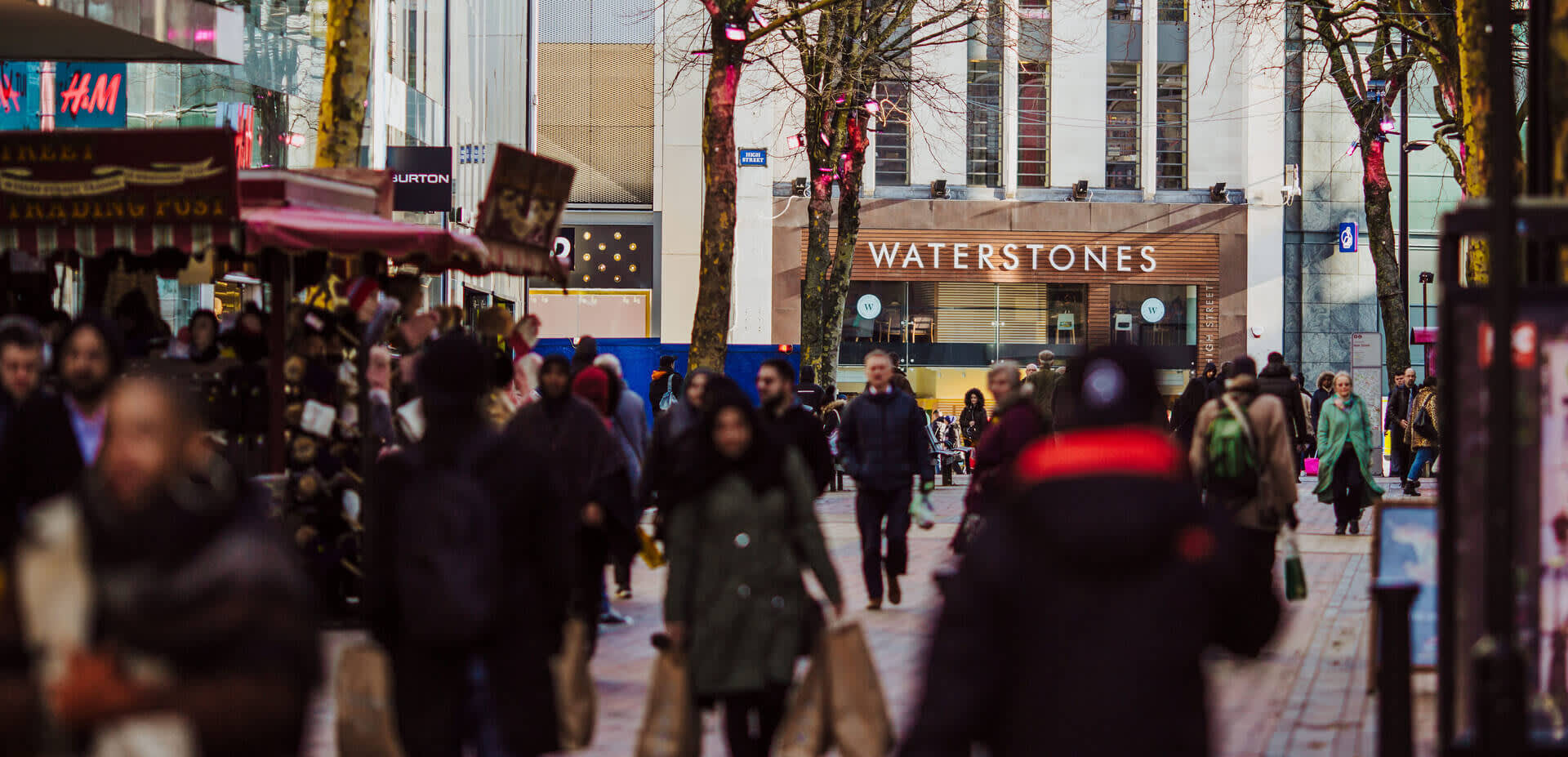 Shoppers on Birmingham New Street, Waterstones is visible in the background.