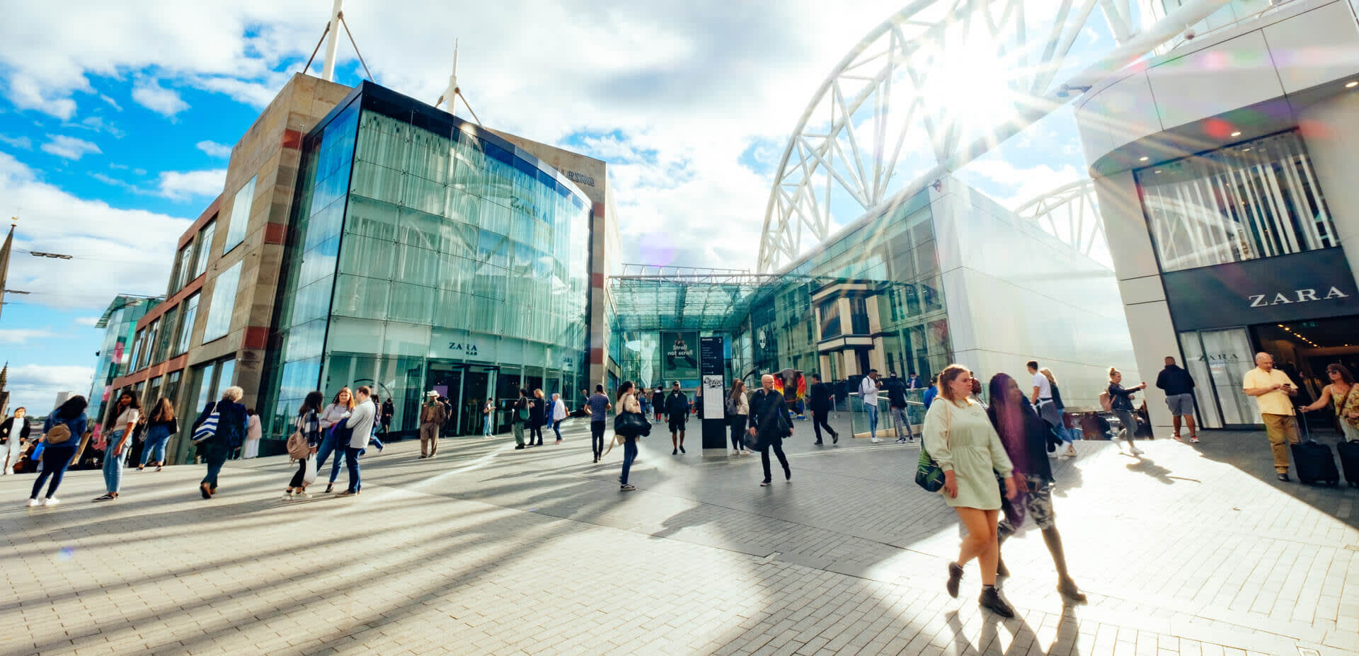 People shopping outside a large shopping centre, Bullring, Birmingham