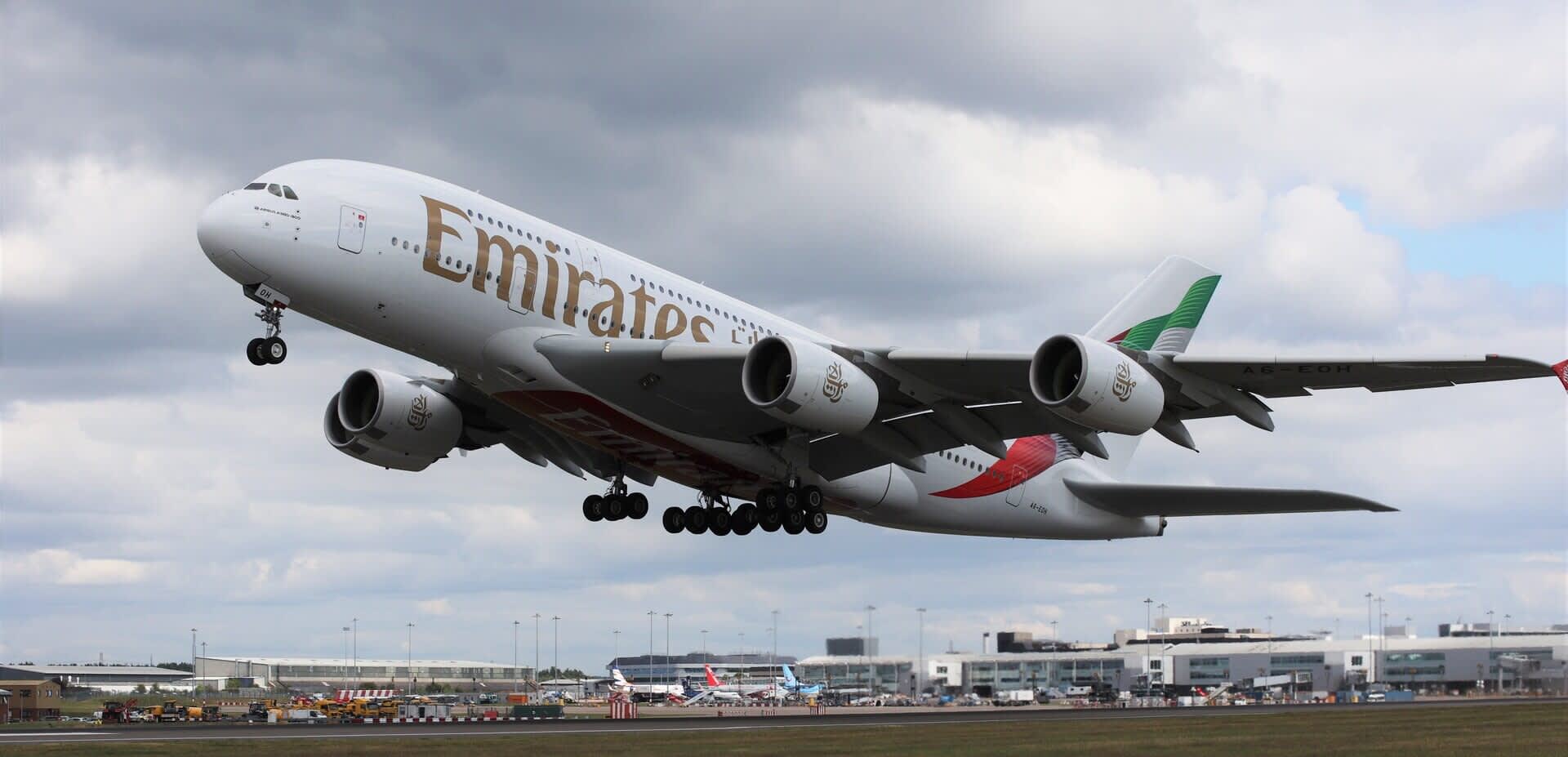 Emirates A830 plane flying out of Birmingham International Airport