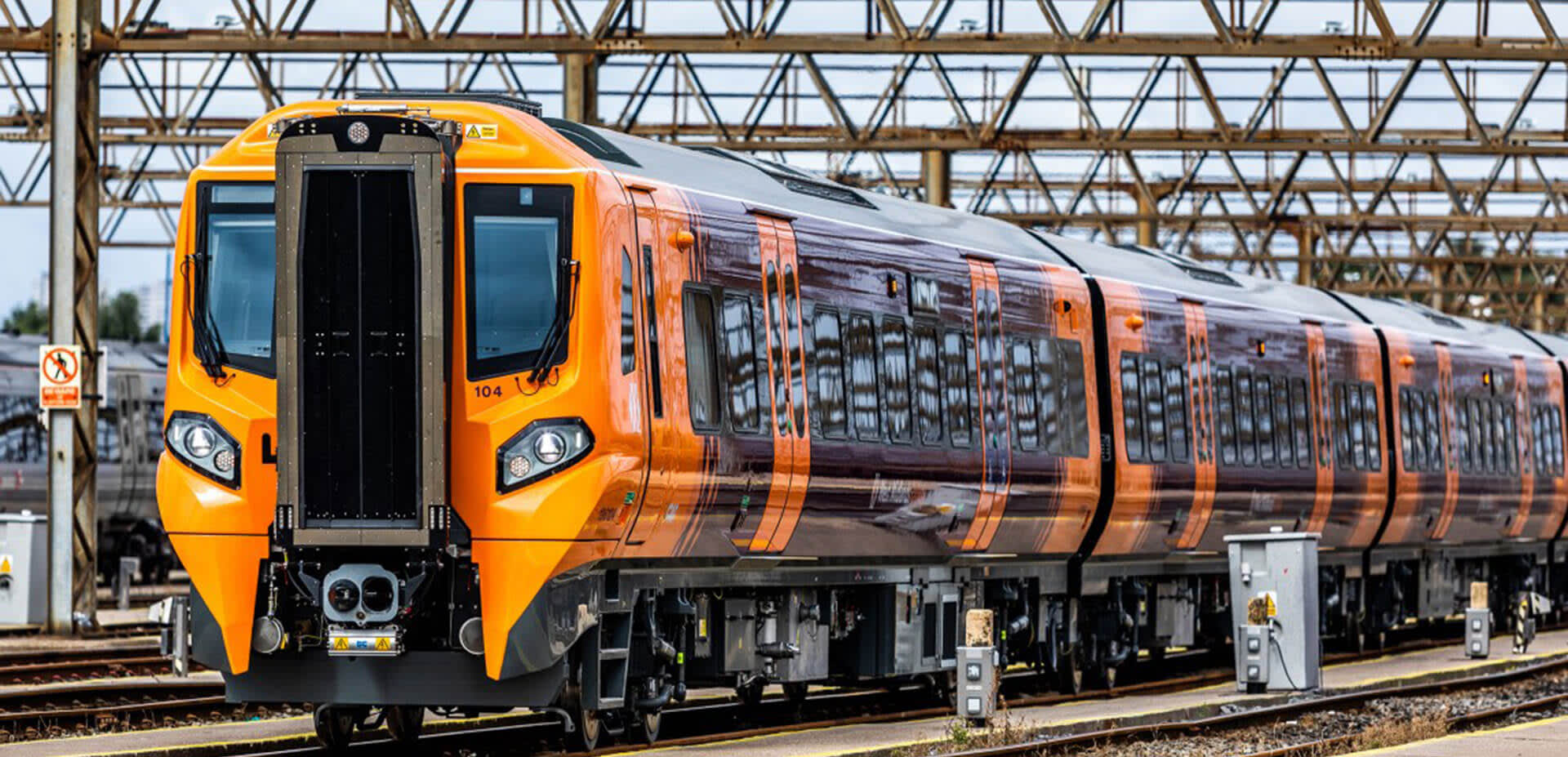 West Midlands Trains Class 196 train in orange and purple livery