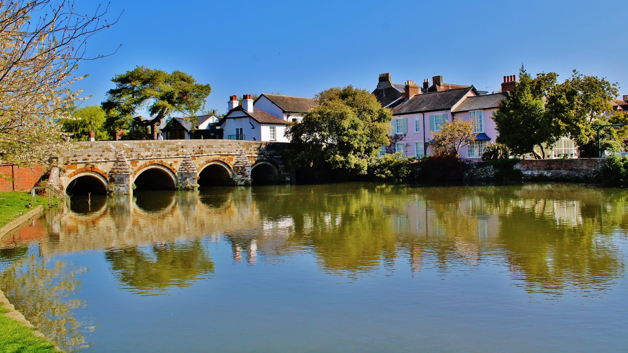 View over the water of Town Bridge and houses