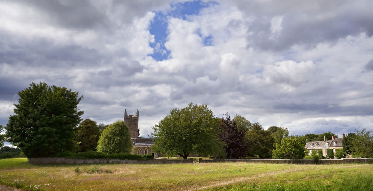 View across fields towards Kingham church