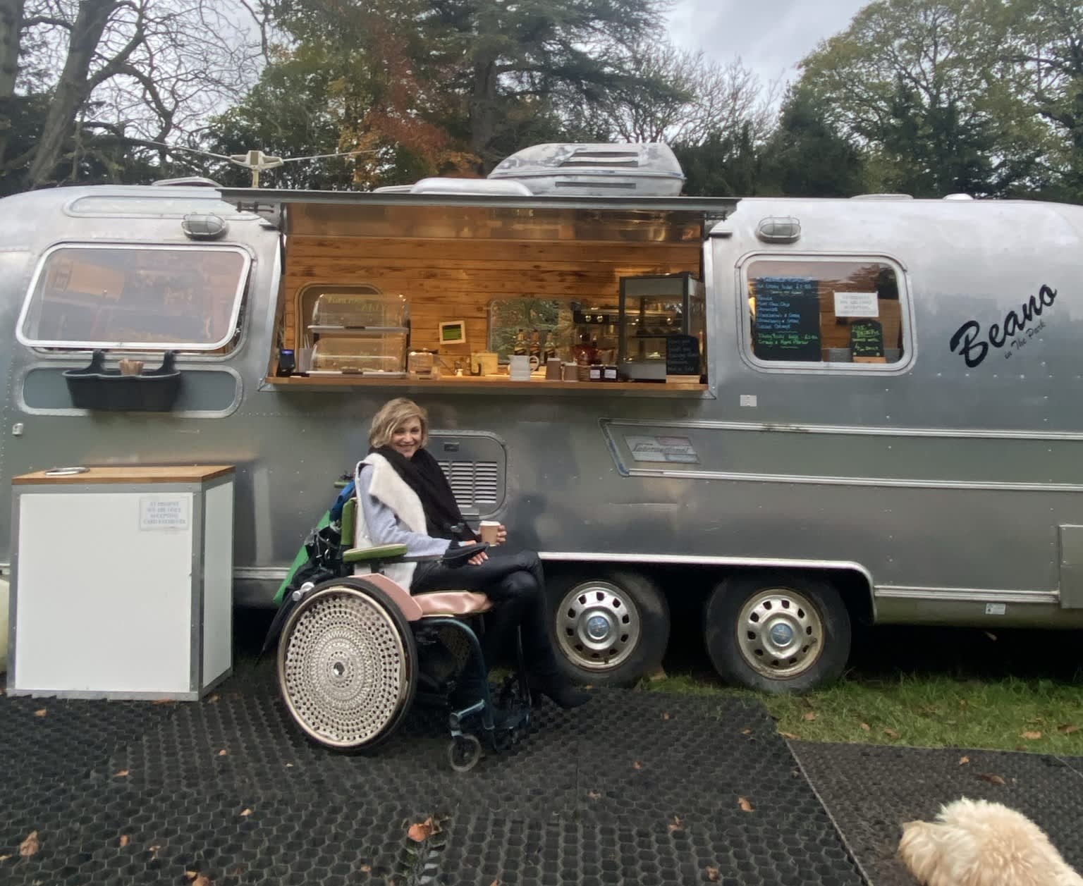 Heidi by a food van in her wheel chair