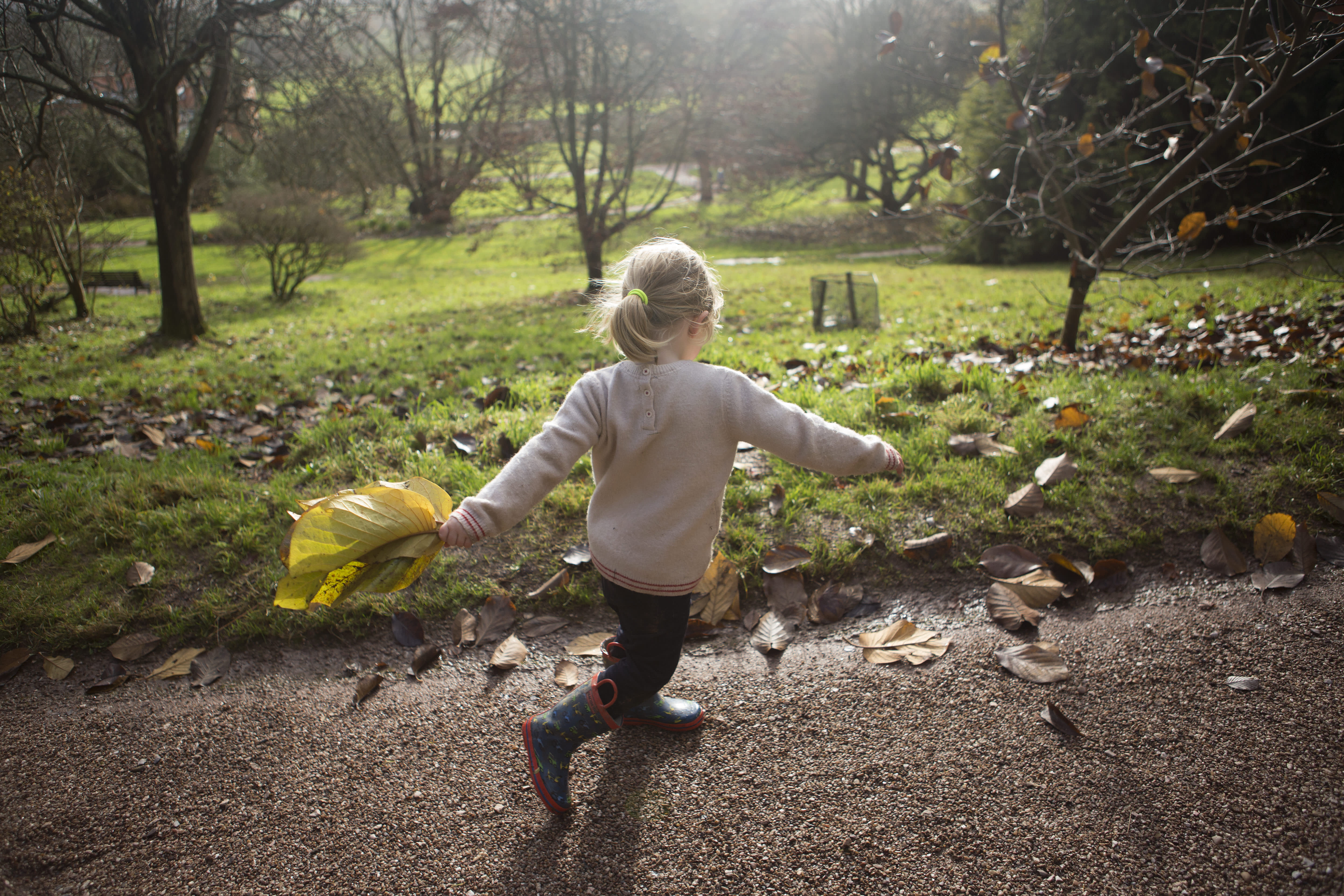 Child with leaves at Killerton