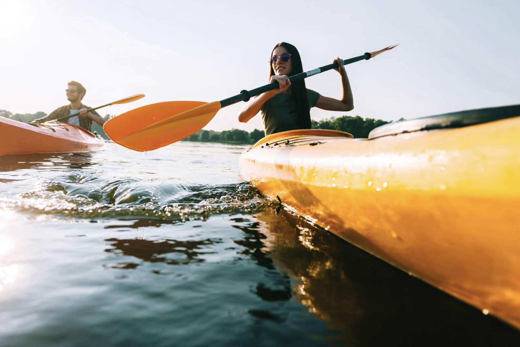 a couple in yellow kayaks