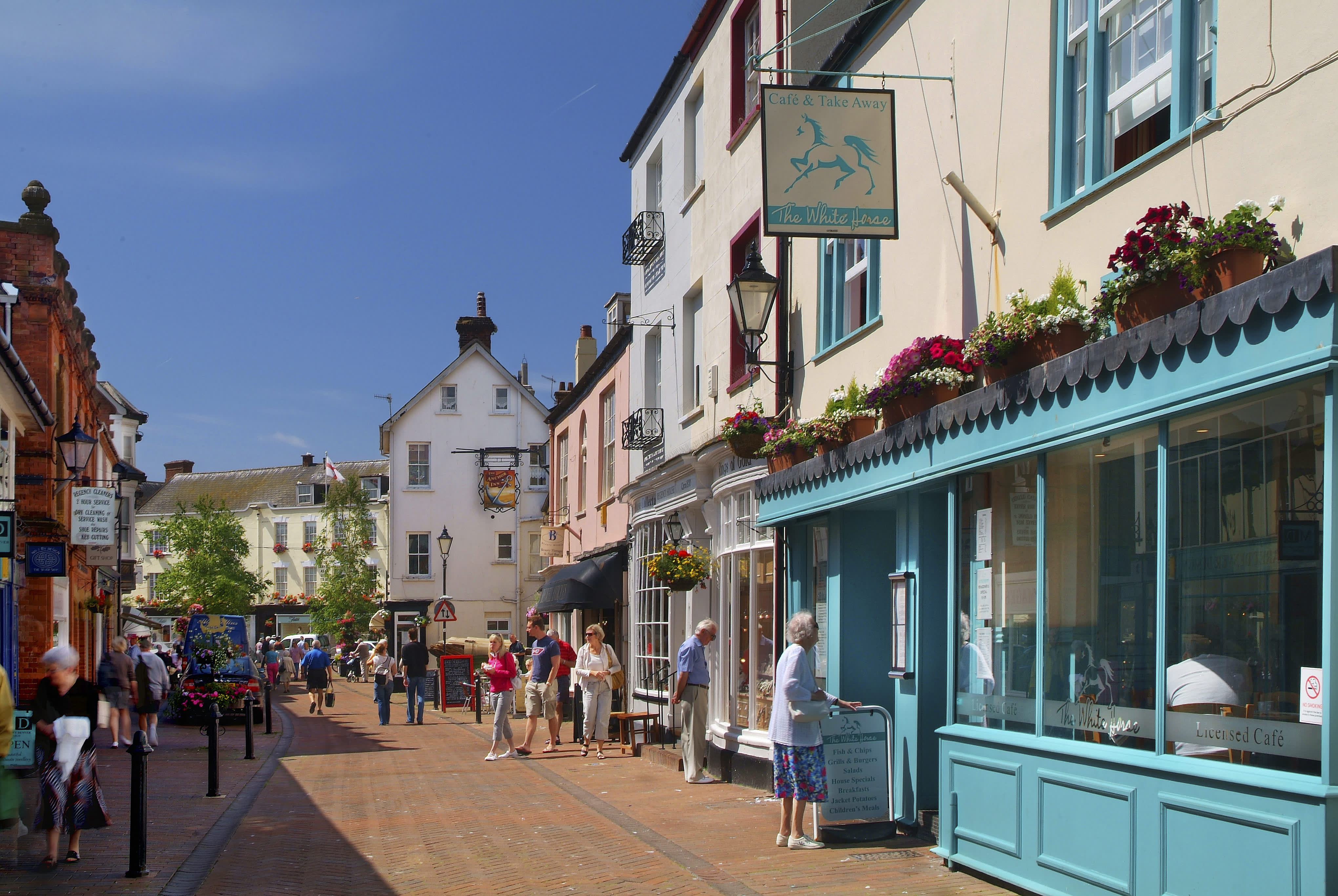 sidmouth high street with some people walking about