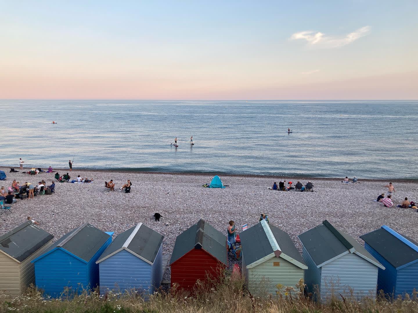 view of beach huts on budleigh beach