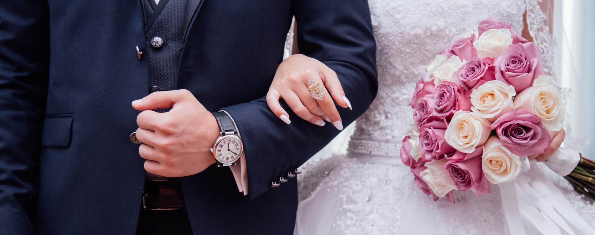 A bride and groom standing arm-in-arm at their East Yorkshire wedding