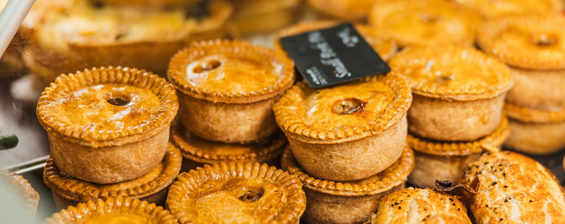 A display of freshly made pork pies in the counter at Drewton's Farm Shop in East Yorkshire
