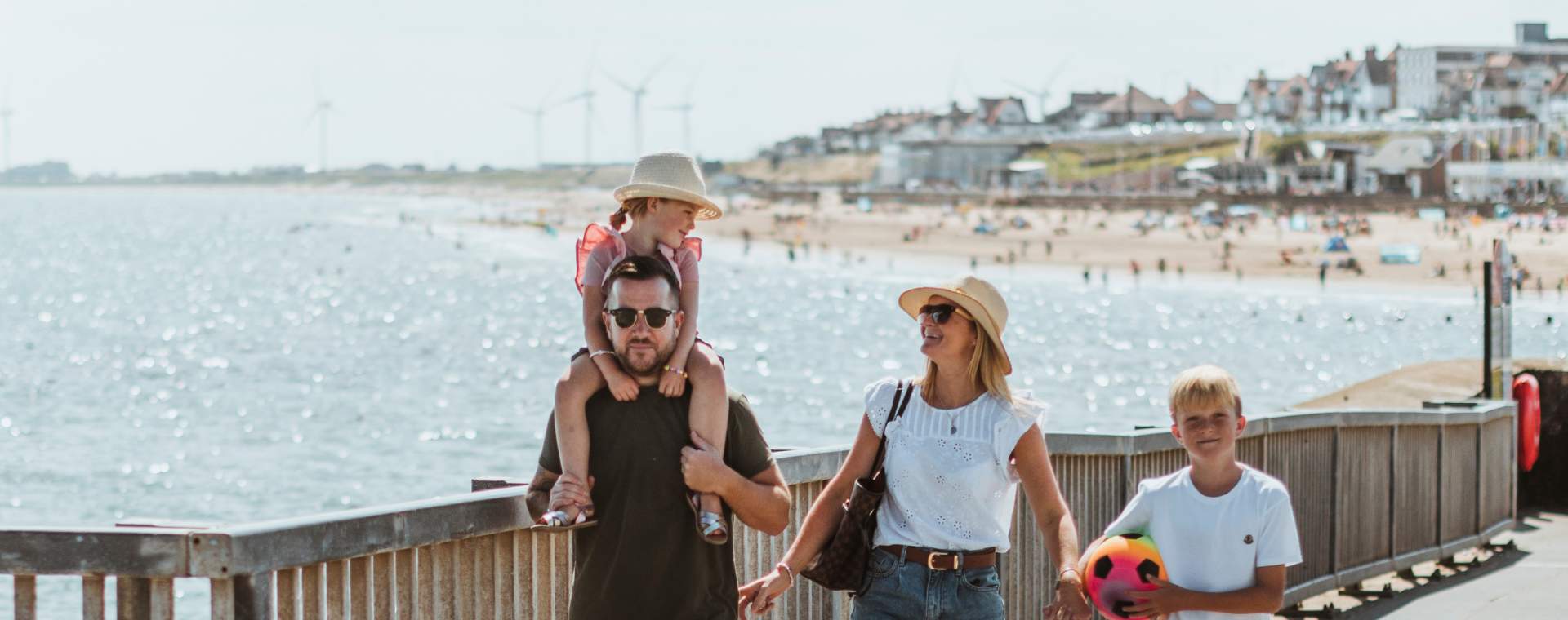 A family walk along the sea front in Bridlington, East Yorkshire