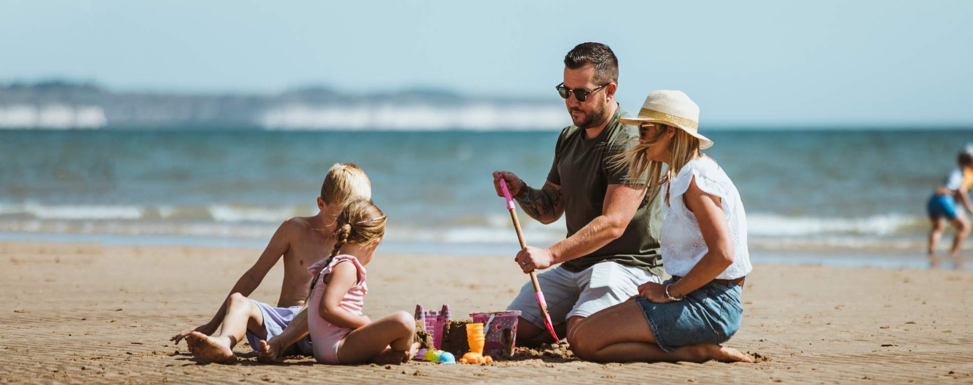 A family build sandcastles on the beach in Bridlington, East Yorkshire