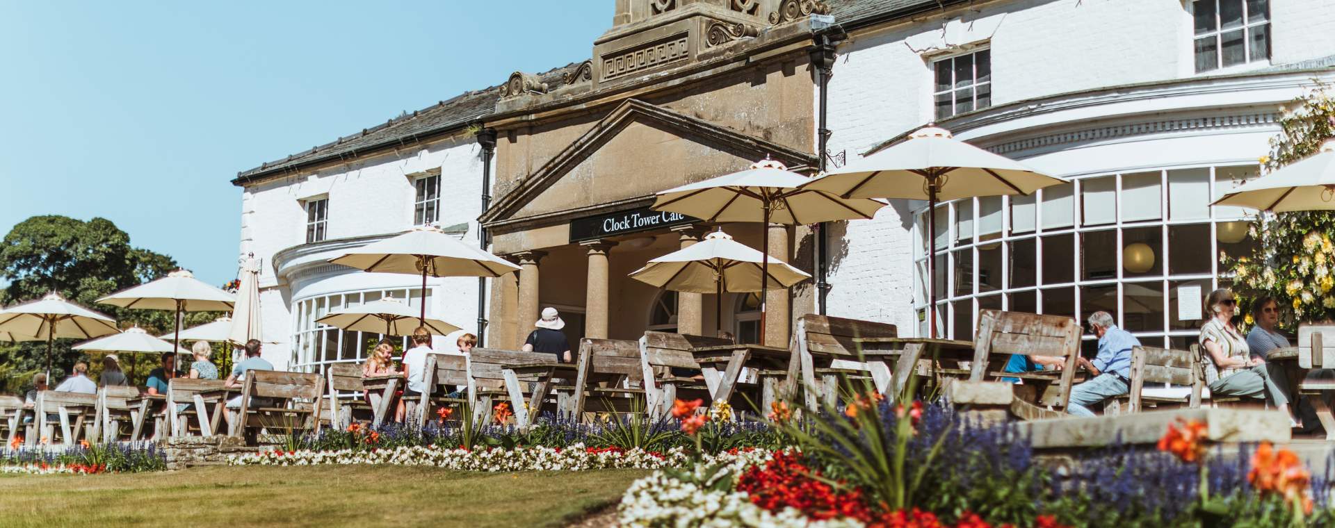 People sat outside the Clock Tower Cafe at Sewerby Hall