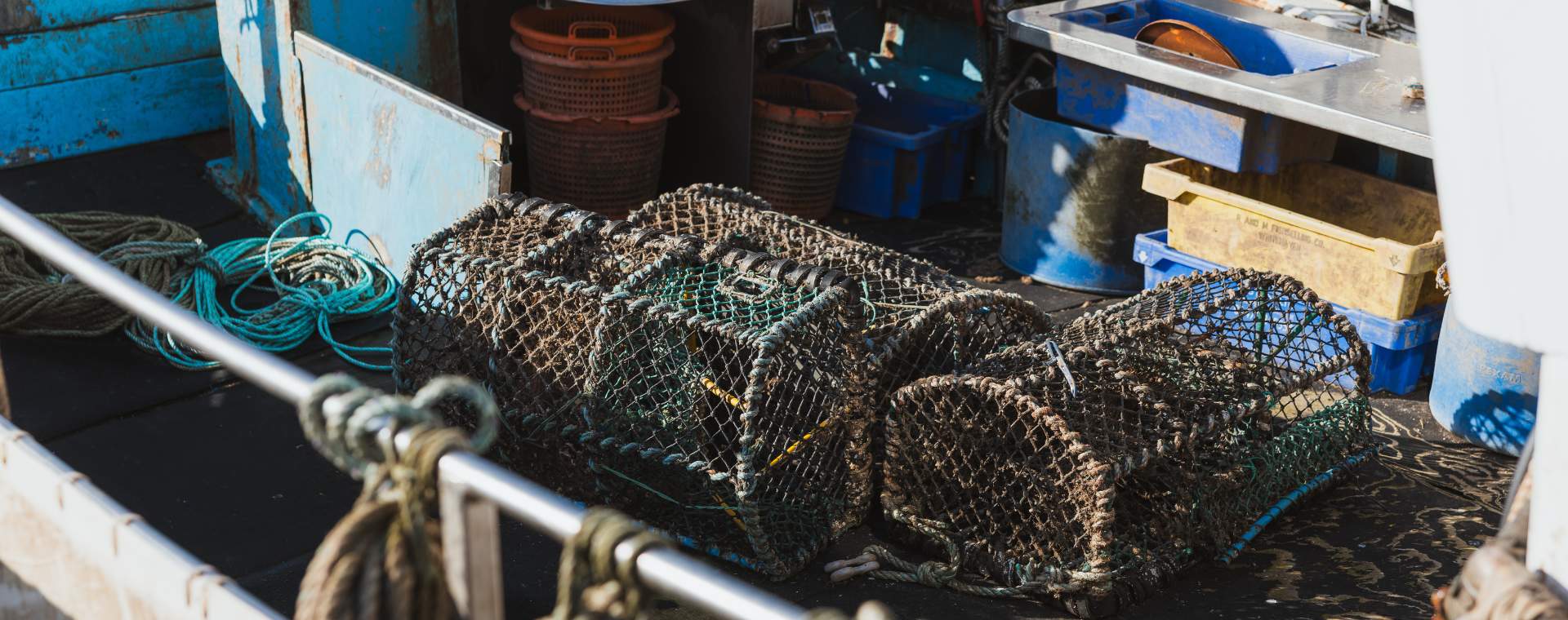 A fishing trawler filled with lobster pots