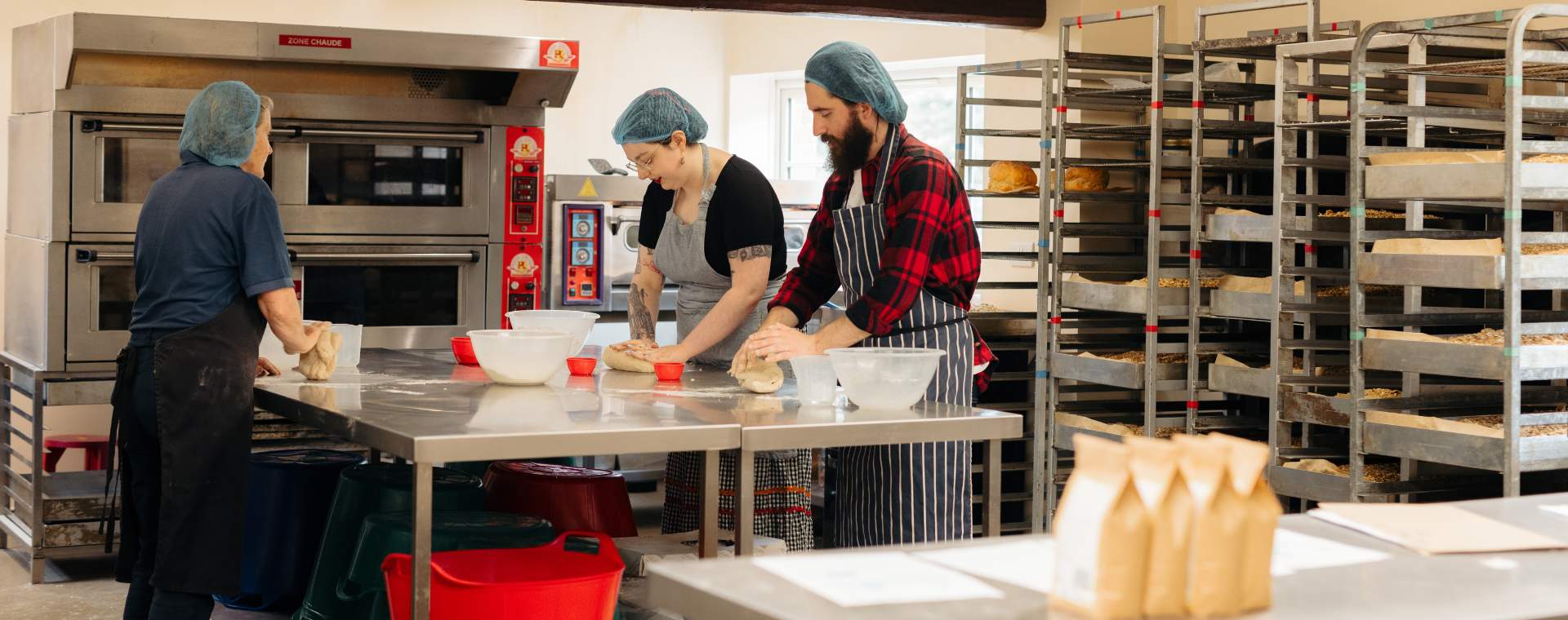 Two people taking part in a bread making workshop at Side Oven Bakery in East Yorkshire.