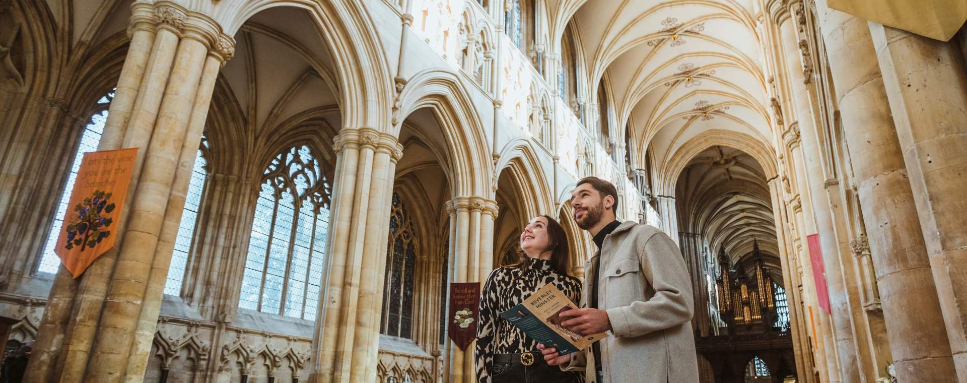 A couple admiring the architecture inside Beverley Minster