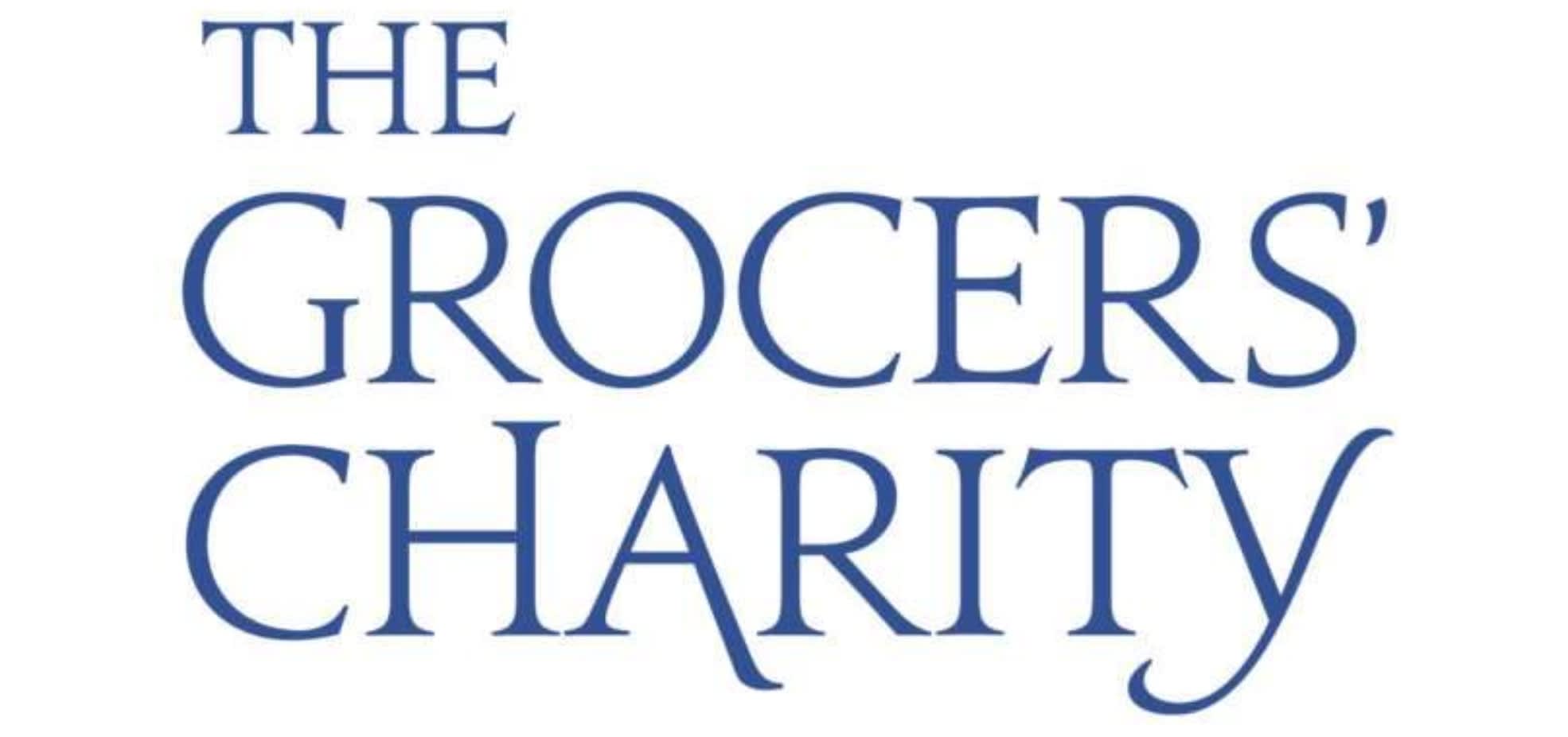 The Grocers Charity logo. The words are written in blue writing.