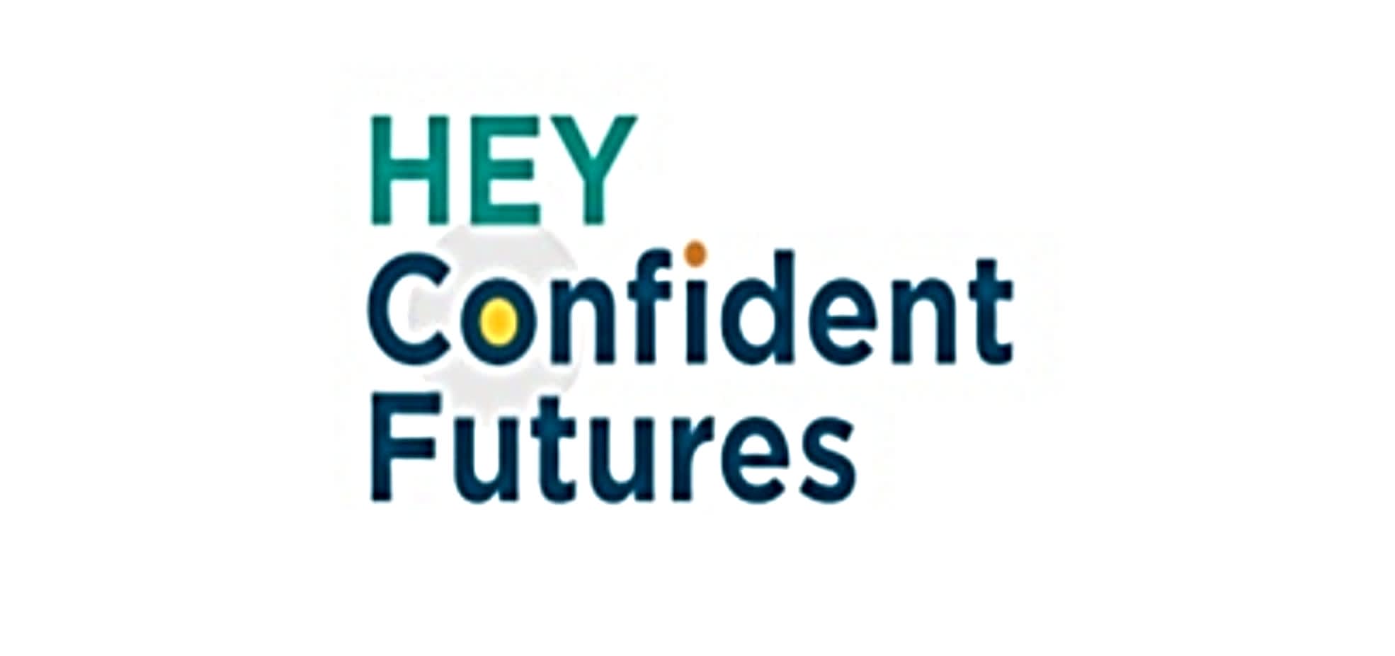 The HEY Confident Futures logo. HEY is in light blue text at the top. Confident in underneath in dark blue text. The inside of the letter O is filled yellow. Futures in at the bottom in dark blue text.