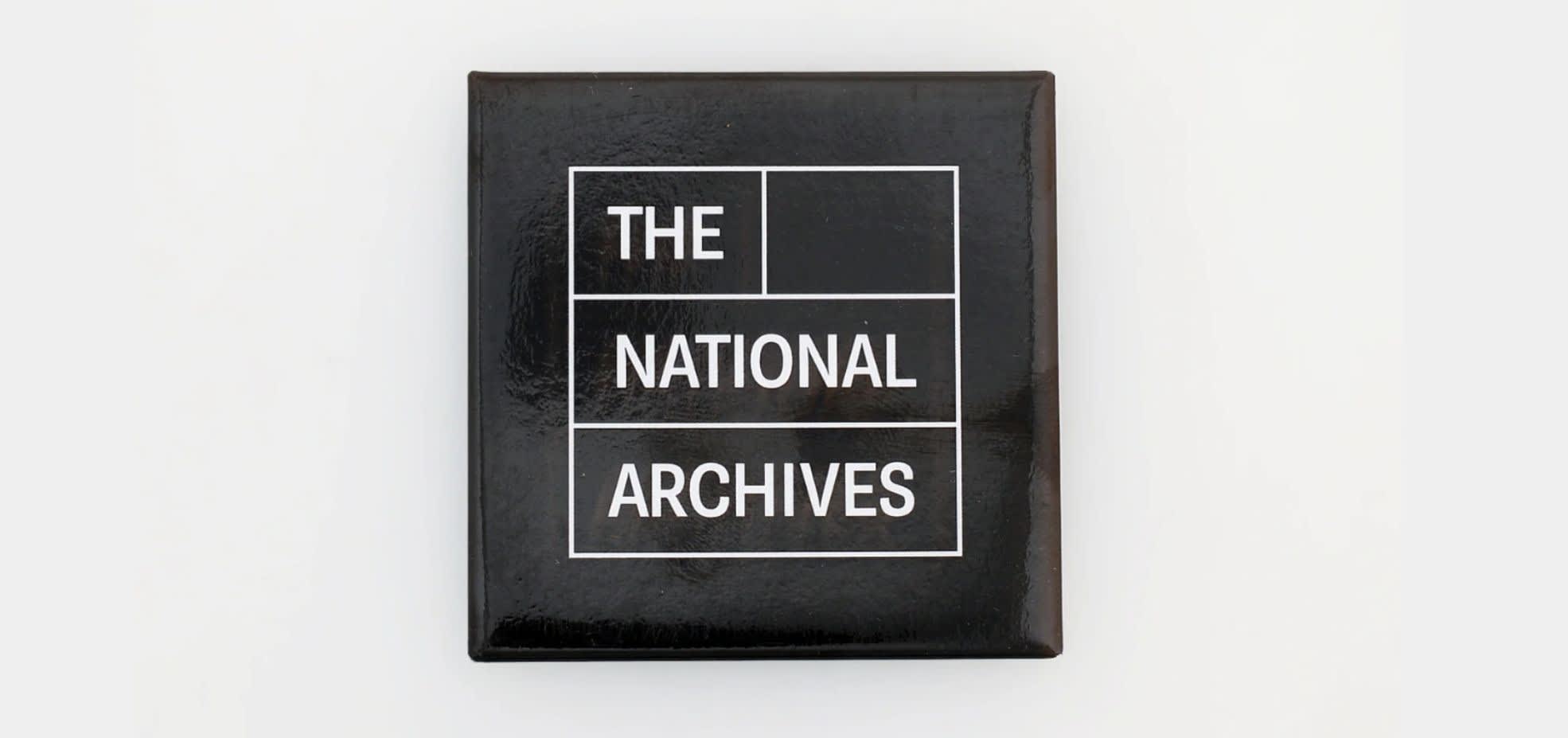 The National Archives Logo - The National Archives is written in white writing and each word is in an individual white box. The writing and square outlines are in a black square upon a white background.