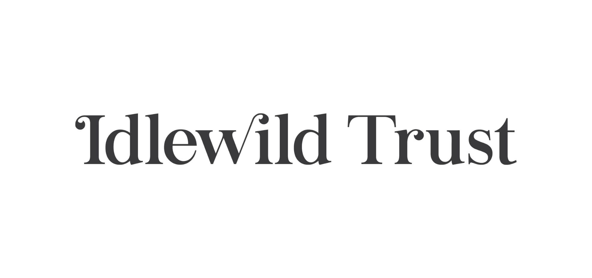 The Idlewild Trust logo. Idlewild Trust is in black writing with a white background.