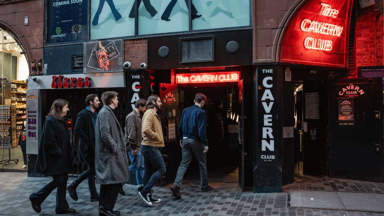 Red Rum Club, a band from Liverpool walking into the Cavern Club