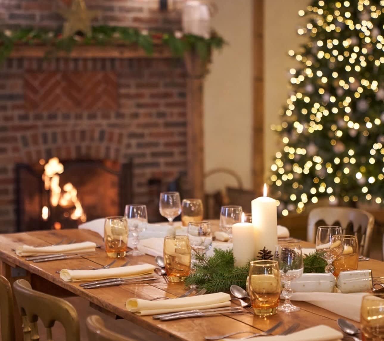 Christmas dining by the fireplace at Burley Manor in the New Forest