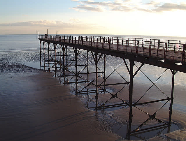 View of Bognor Regis boardwalk overlooking the ocean at low tide