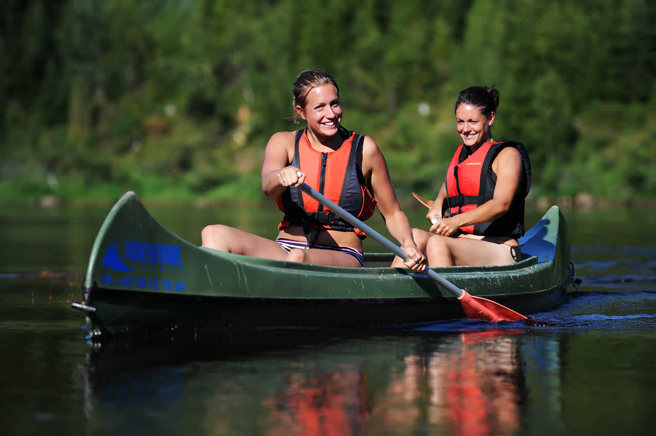 Two girls canoeing on the river