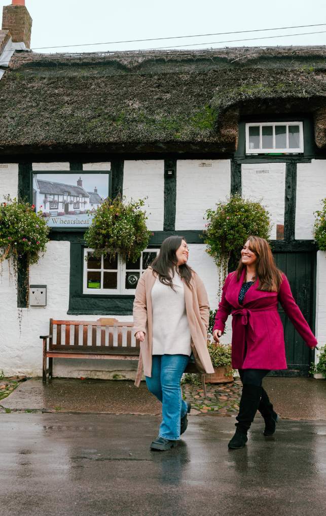 Two girls leave a country pub in Wirral