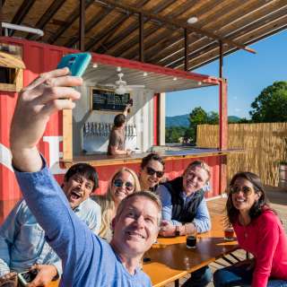 The Highland Brewing Rooftop offers beautiful views of the mountains in a cool Asheville setting