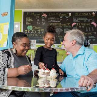 A family enjoys delicious ice cream at The Hop Ice Cream Cafe in Asheville, NC