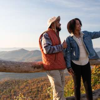 Two visitors take a selfie on the Blue Ridge Parkway near Asheville, NC