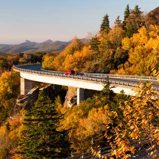 The Linn Cove Viaduct dressed in fall color just after sunrise