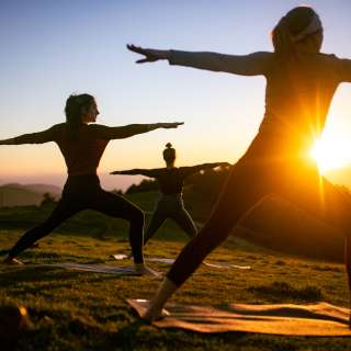Yoga Class Held at Sunset on Mountaintop