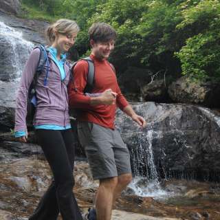 Couple hiking at waterfall