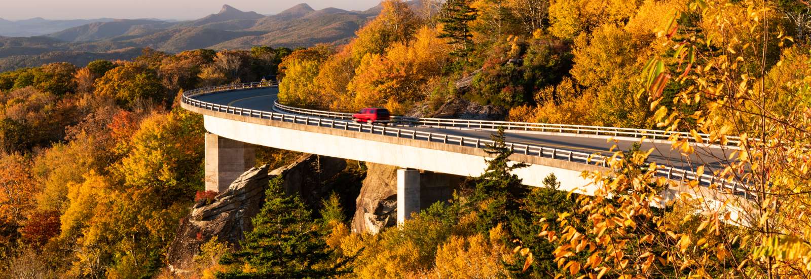 The Linn Cove Viaduct dressed in fall color just after sunrise