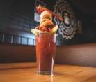 A Bloody Mary with pickle, olive, mini donuts, a hard-boiled egg, and bacon served at Northern Tap House