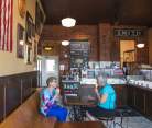Two women eating ice cream at Ramone's Ice Cream Parlor