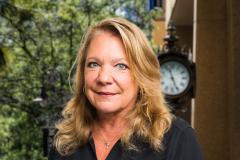 Judie VanPatten Headshot with city background Judie VanPatten Headshot with city background